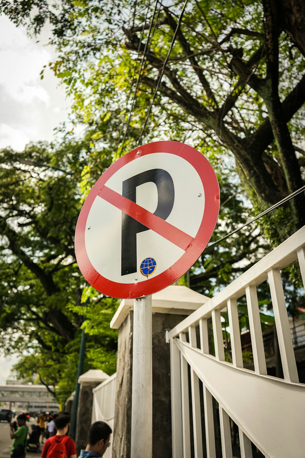 red and white round sign