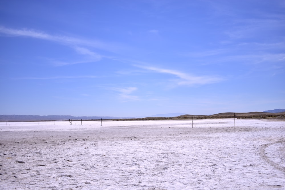 white sand under blue sky during daytime