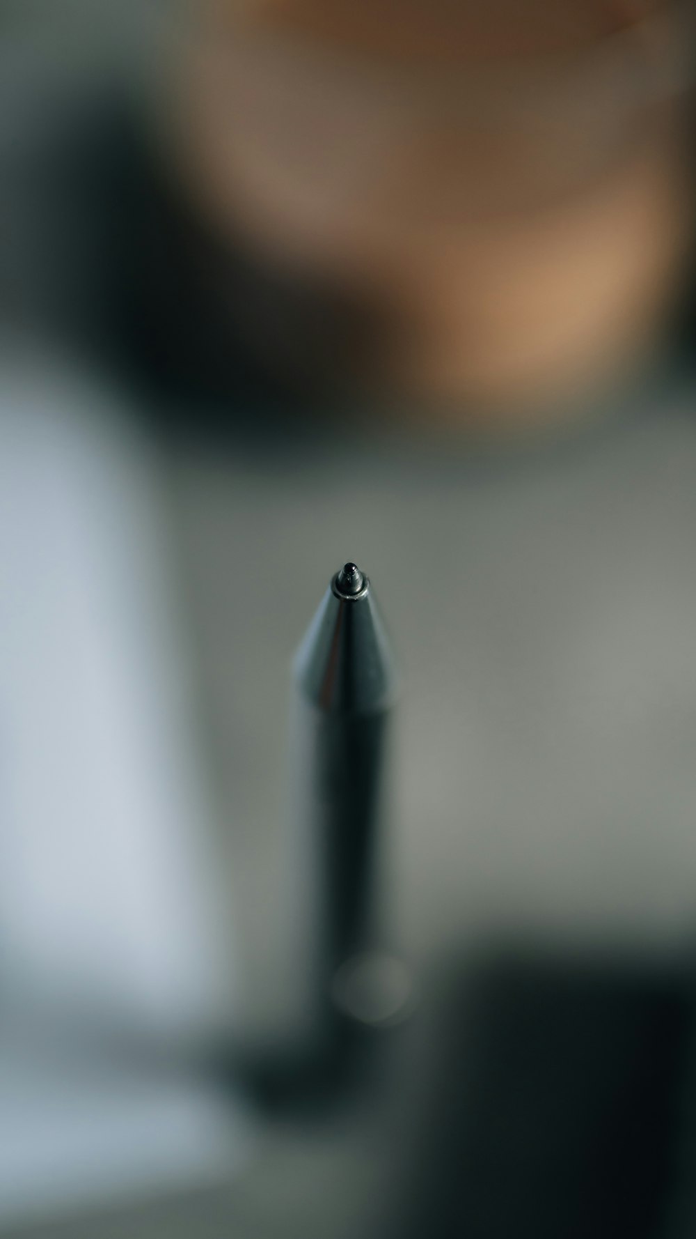 a black pen sitting on top of a table
