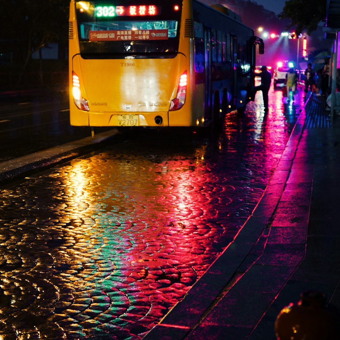yellow bus on road during night time