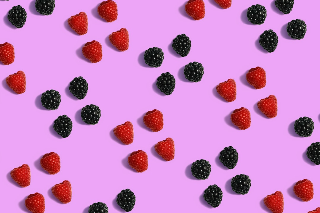 red and black berries on white background