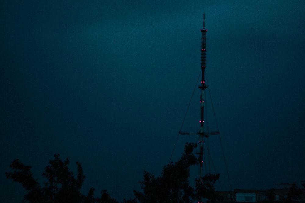 silhouette of tower during night time