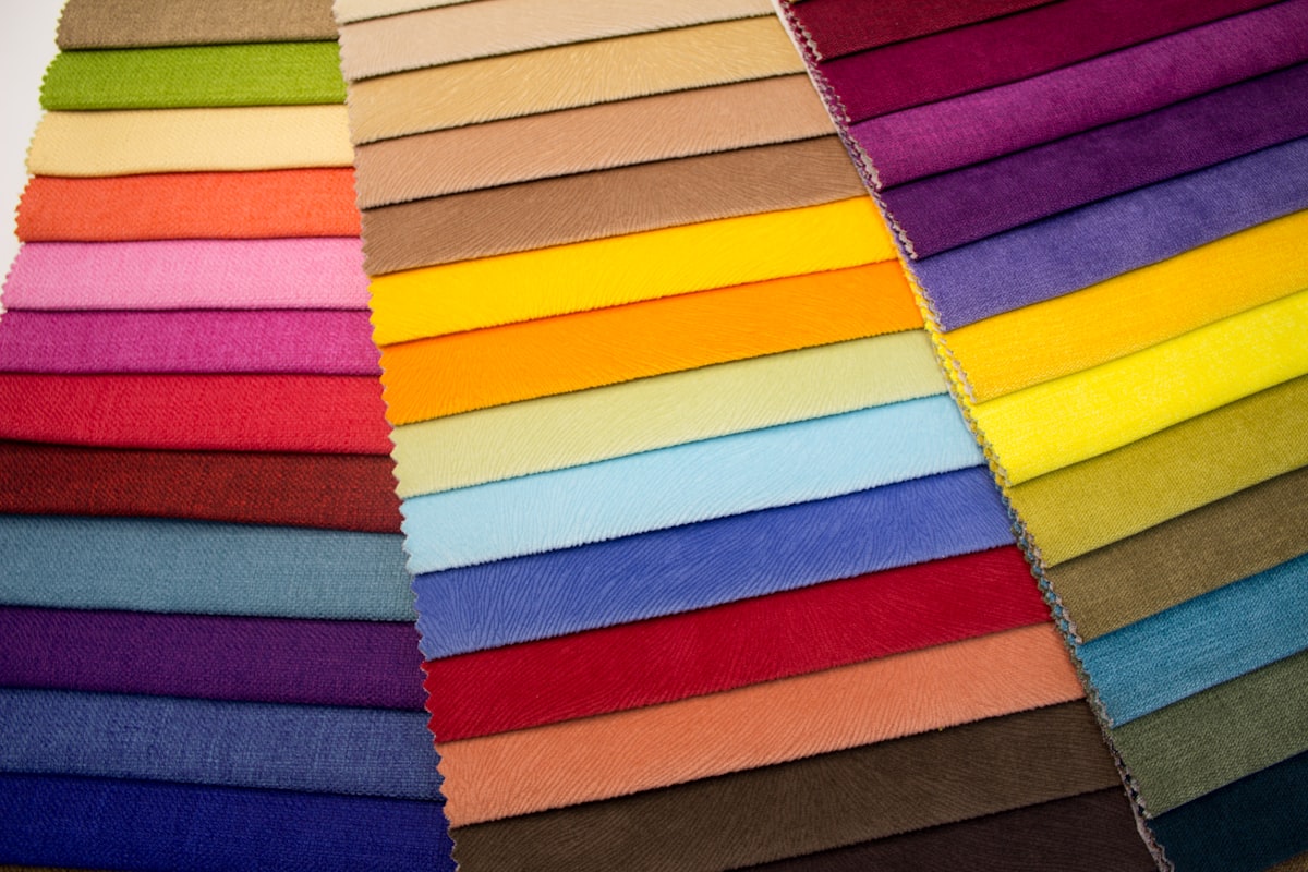 Multi-colored striped upholstery fabric on a wooden table