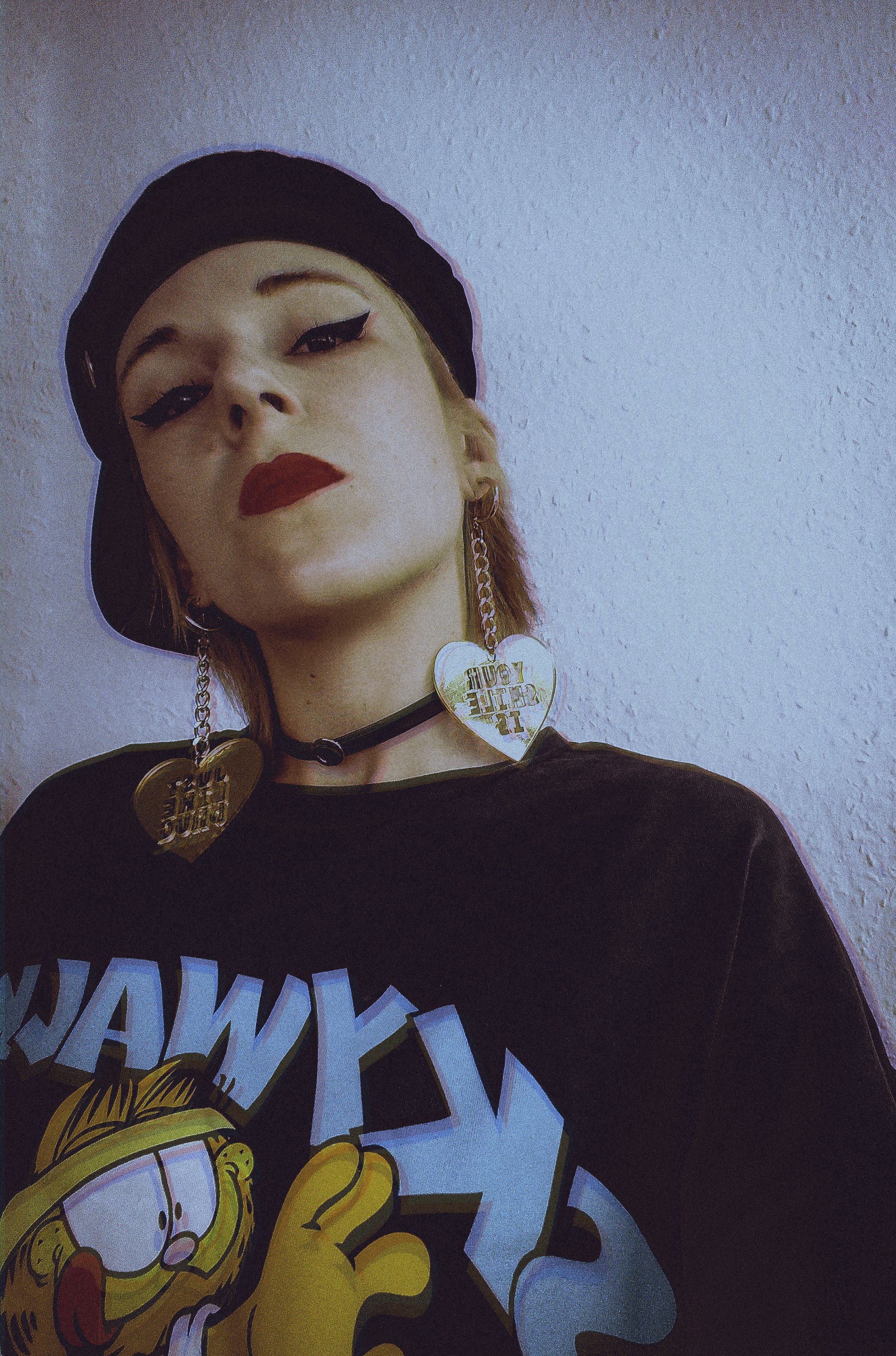 woman in black crew neck shirt wearing silver necklace