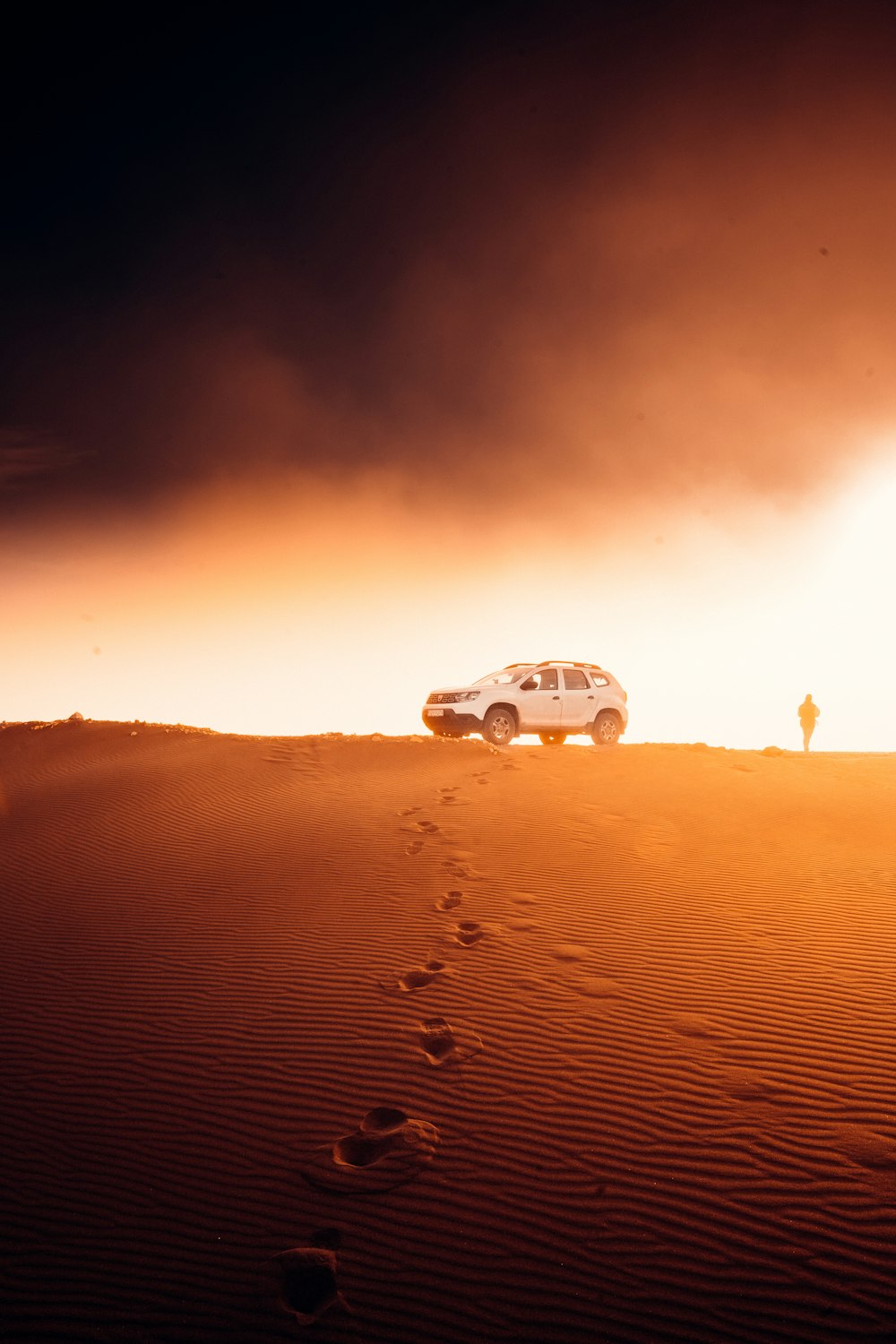 white car on desert during daytime