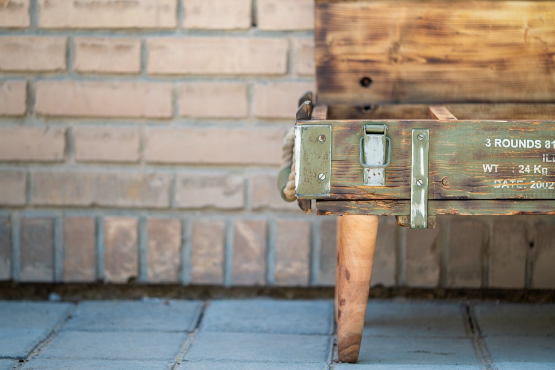 brown wooden box on brown brick wall