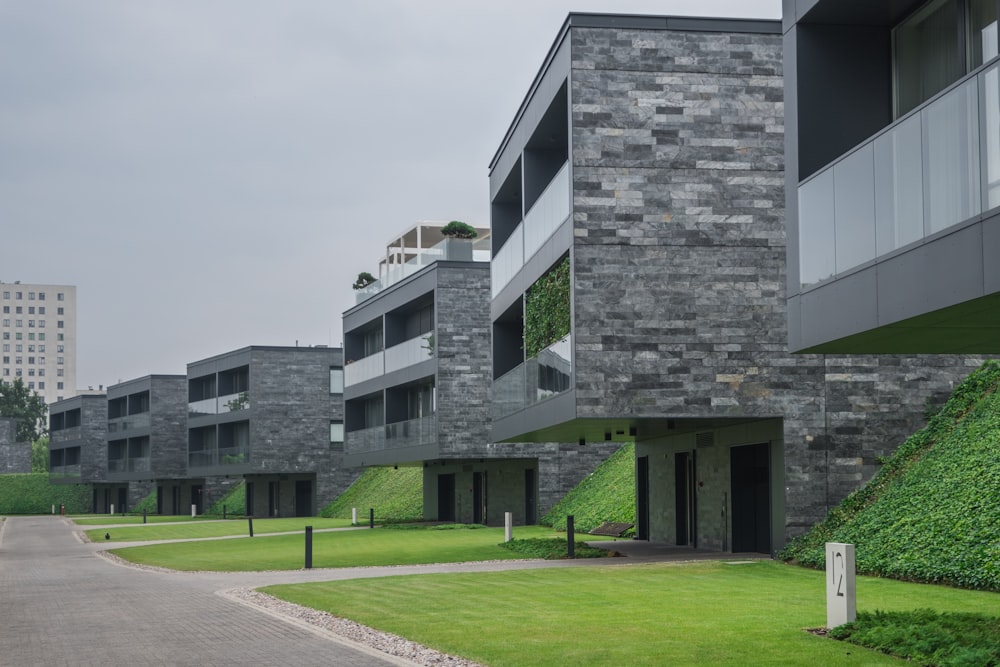 gray concrete building near green grass field during daytime