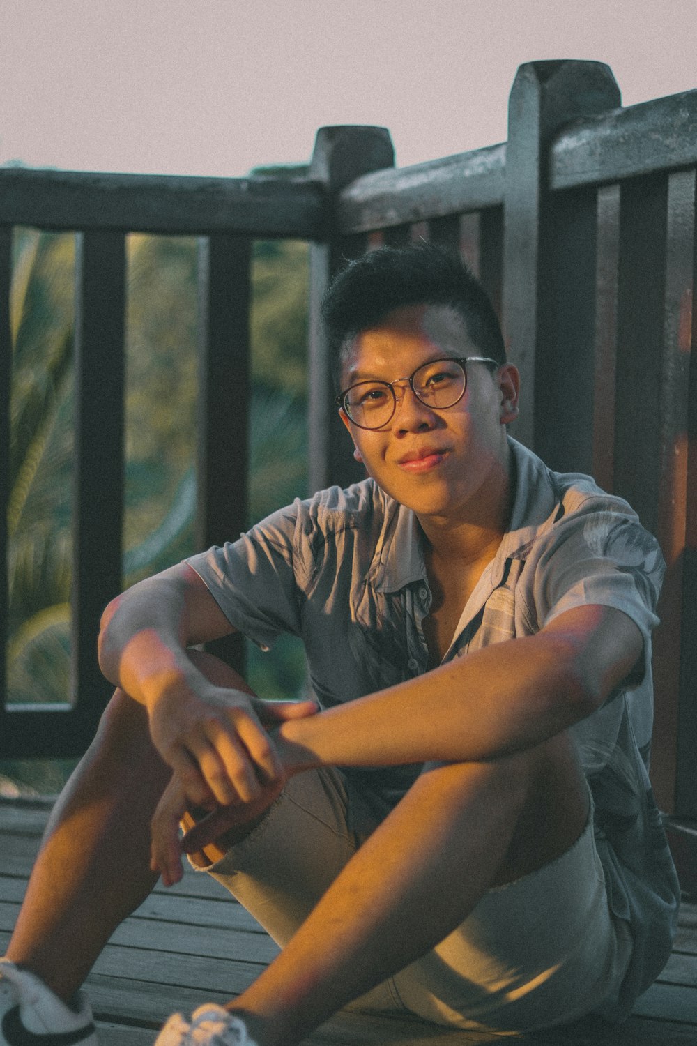 man in gray button up shirt wearing black framed eyeglasses