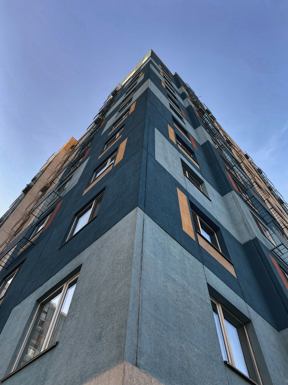 brown concrete building under blue sky during daytime