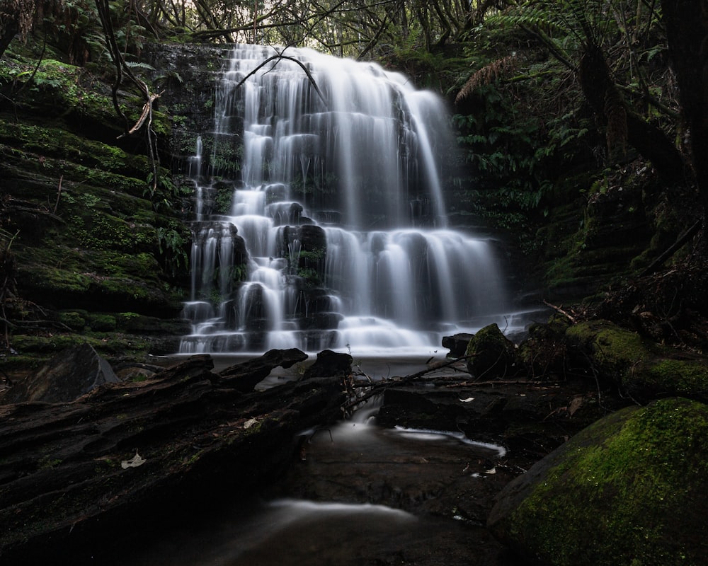 water falls on brown rocky ground