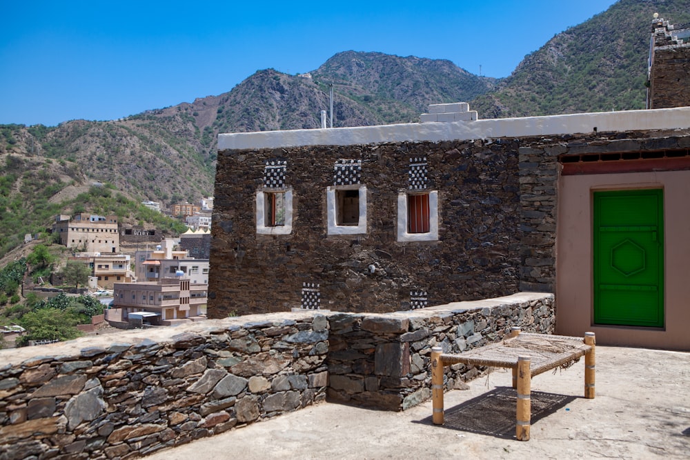 brown brick building near mountain during daytime