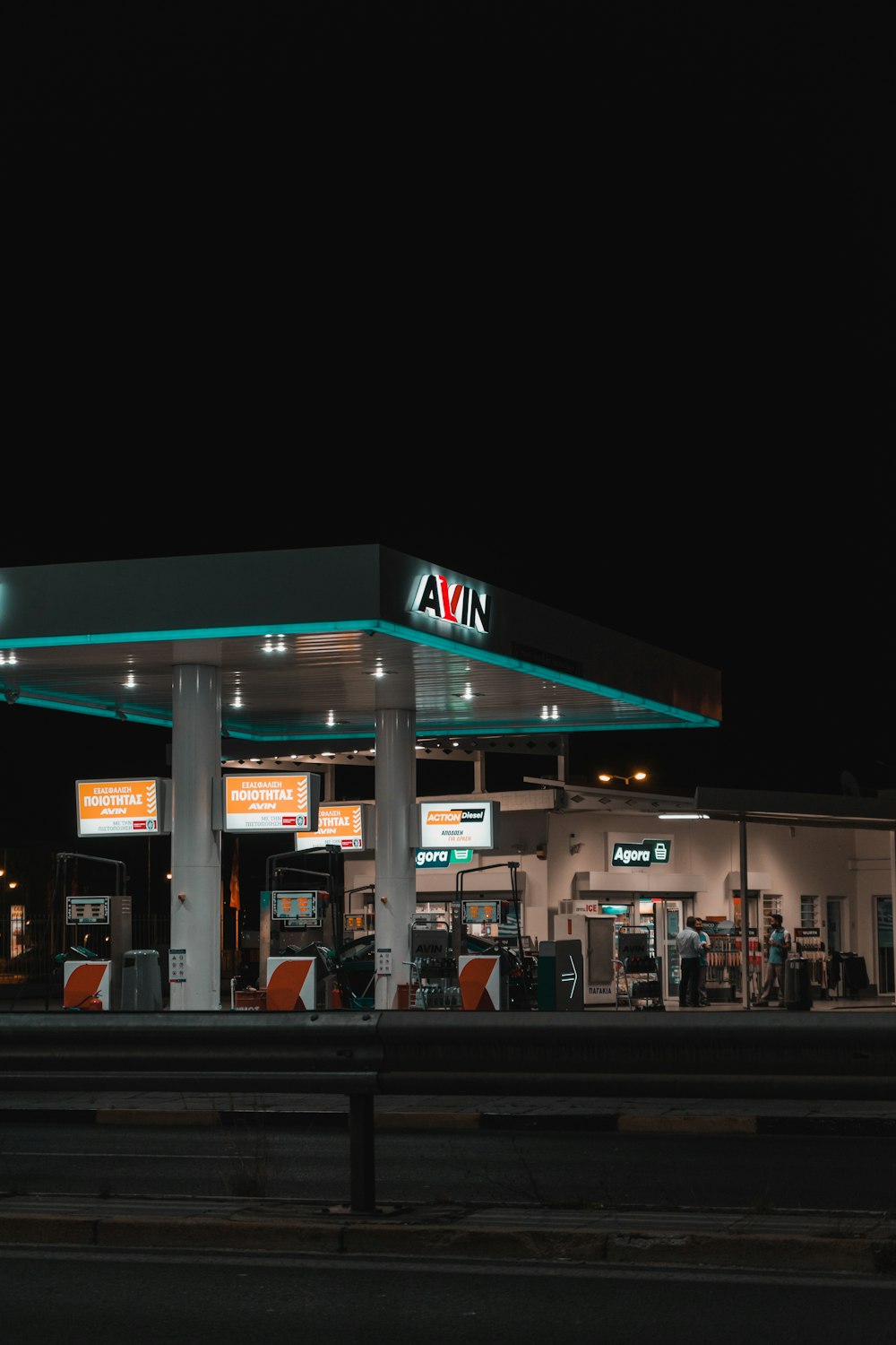 white and green store during night time