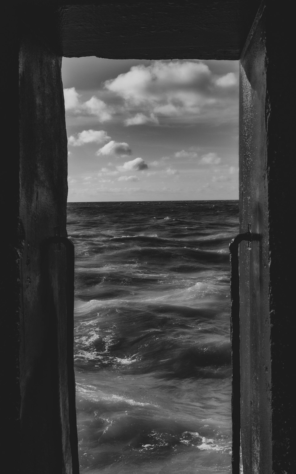 grayscale photo of sea waves