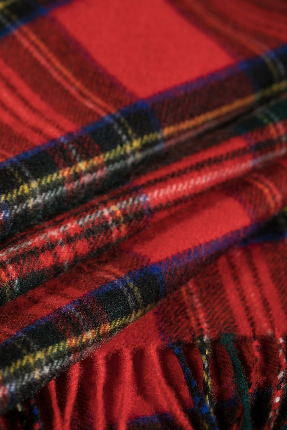 red blue and black plaid textile