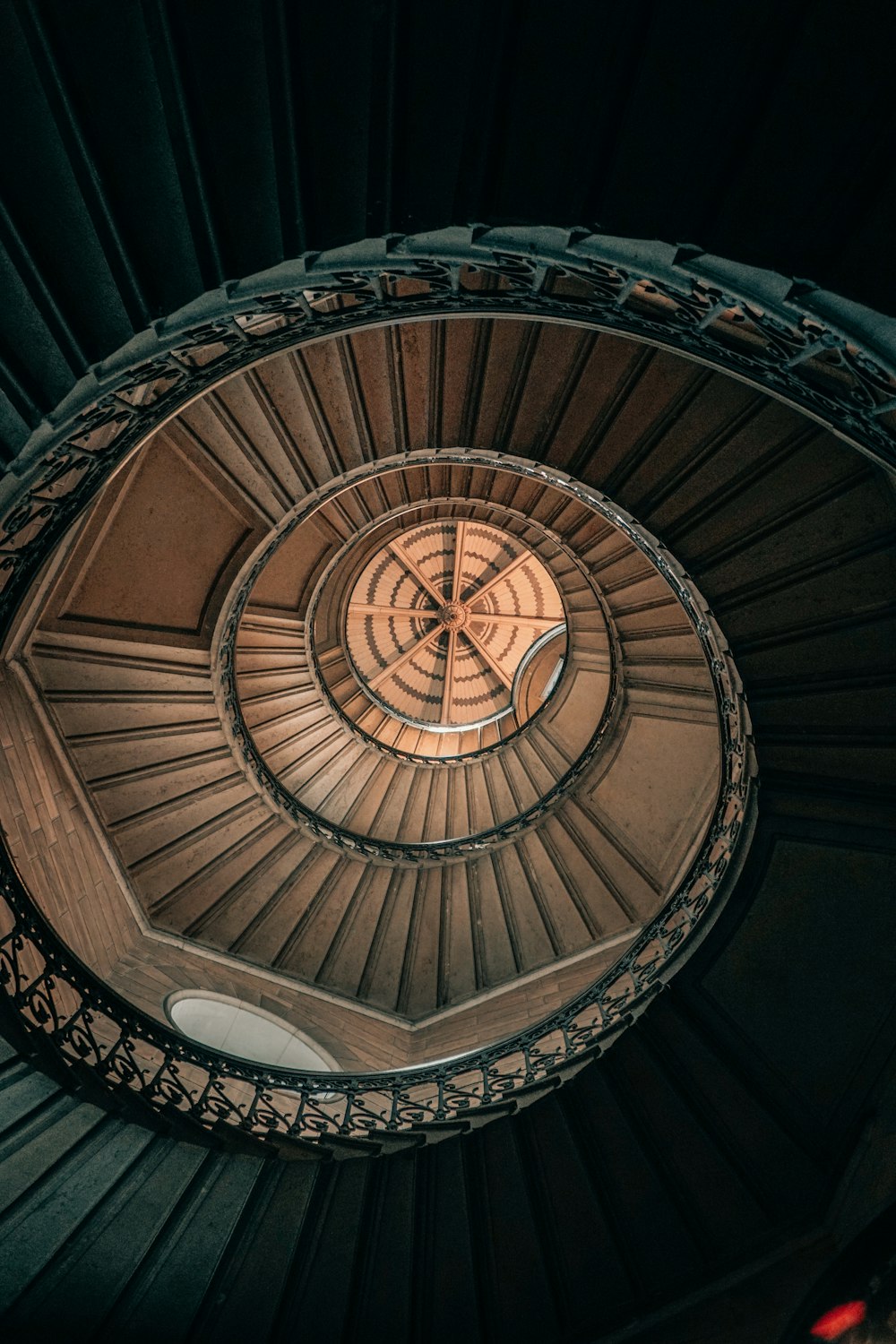 brown spiral staircase with white ceiling