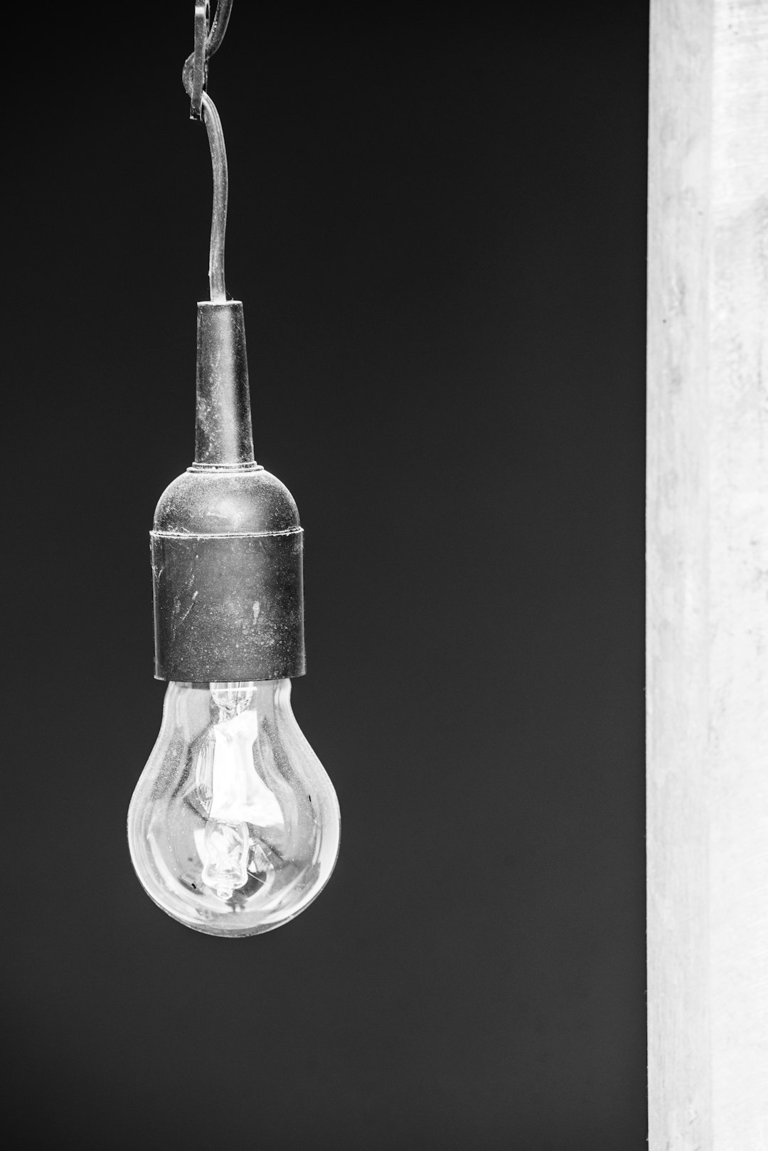 clear glass light bulb in black background