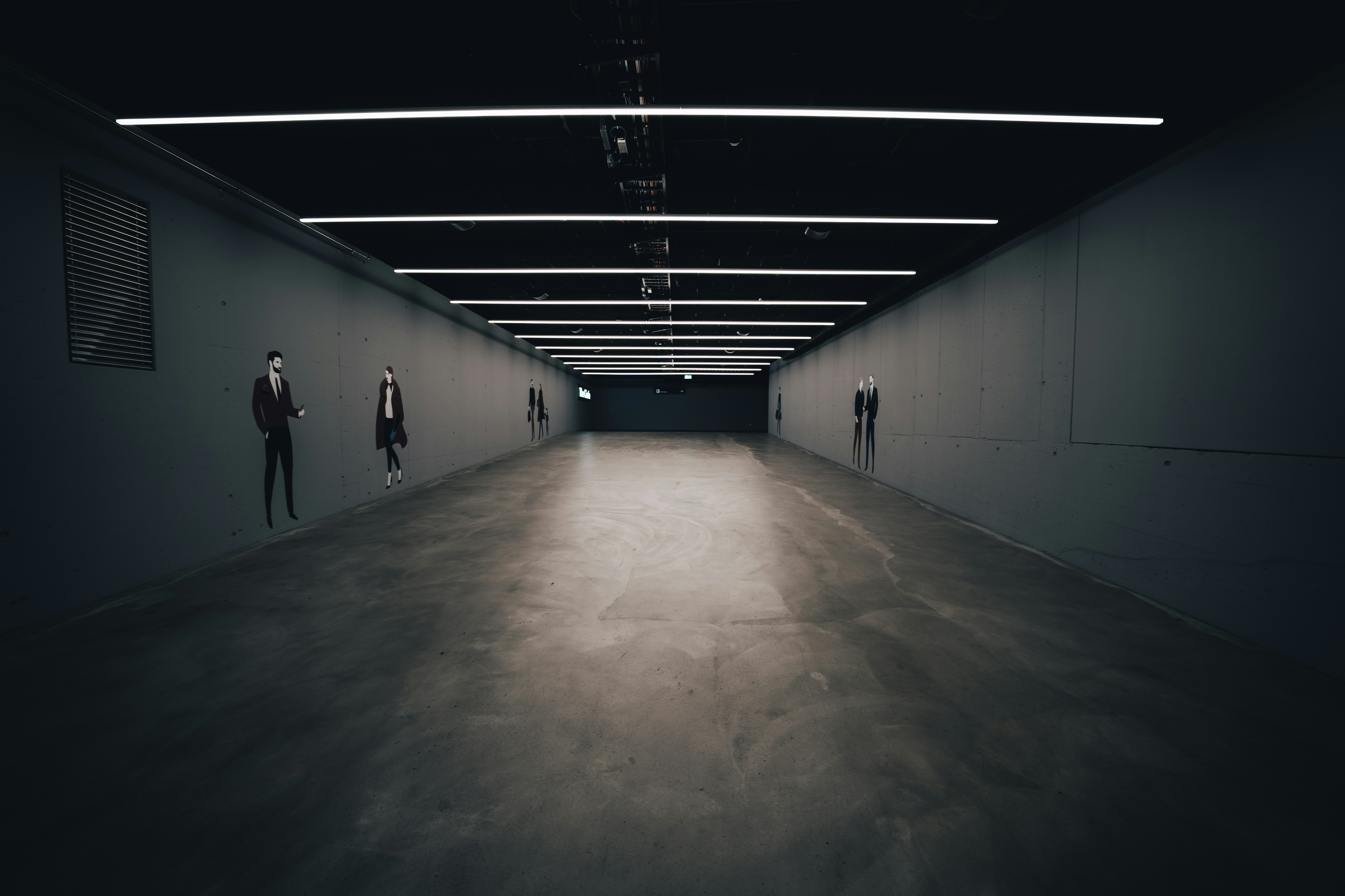 people walking on gray concrete floor