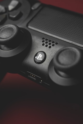 Close-up of a high-performance gaming controller with textured grips.