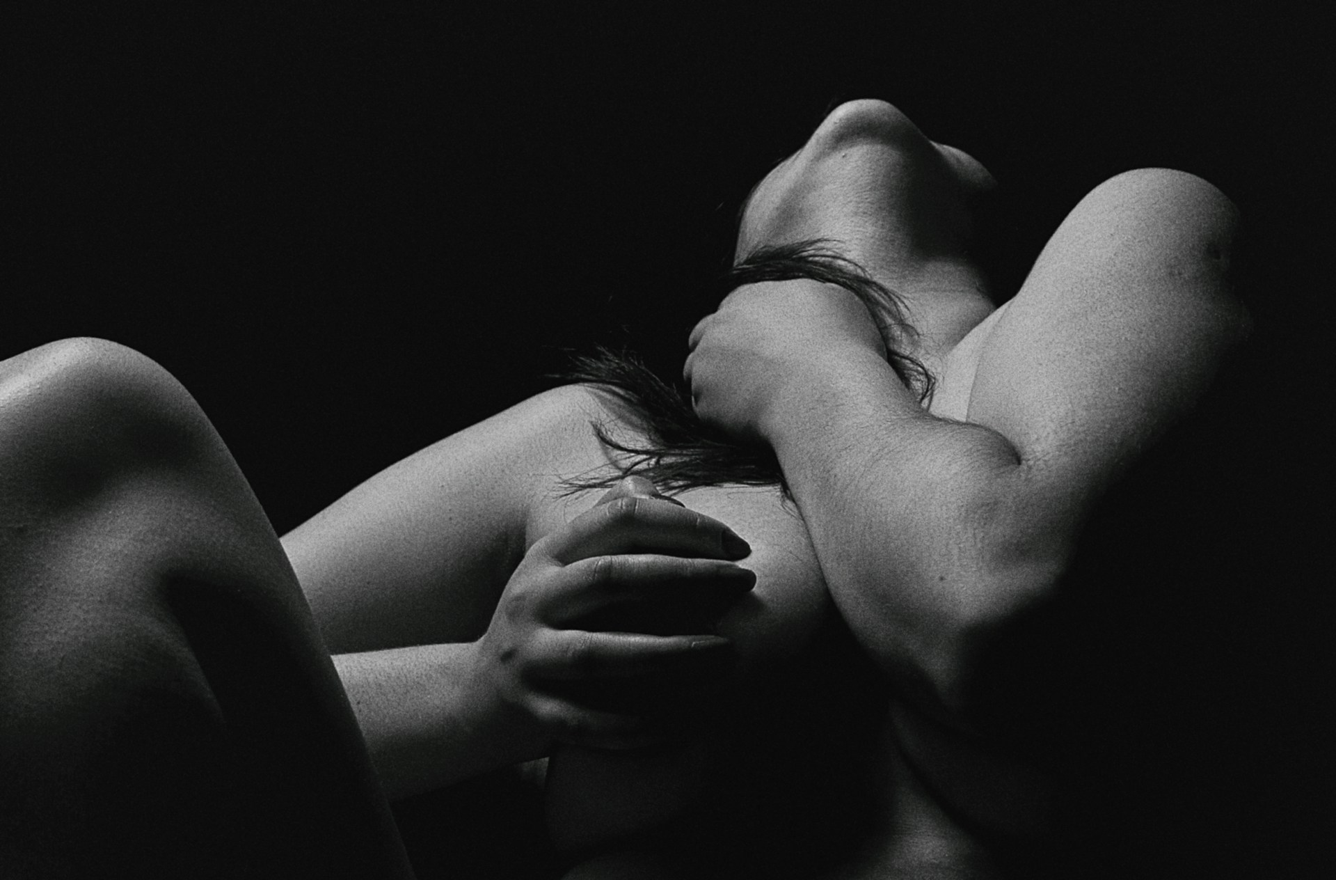 An artistic conceptual photo blending soft shadows and surreal elements, showcasing the model's expressive pose and storytelling.