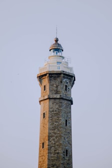 brown brick tower under white sky