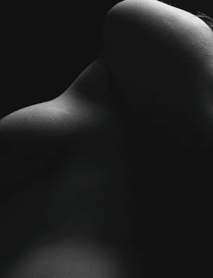 an abstract composition of light and shadow on a smooth bone-colored surface