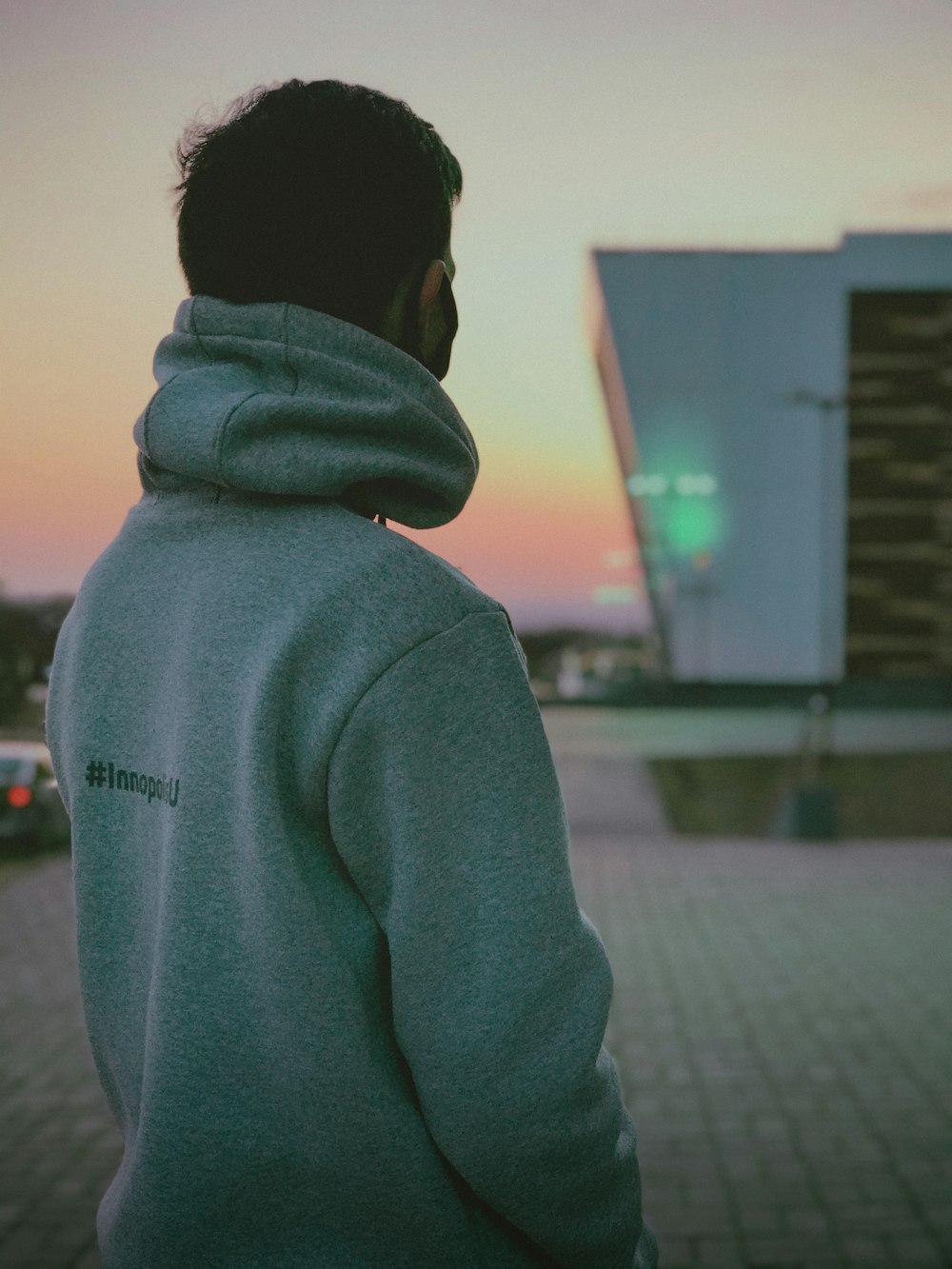 man in gray hoodie standing