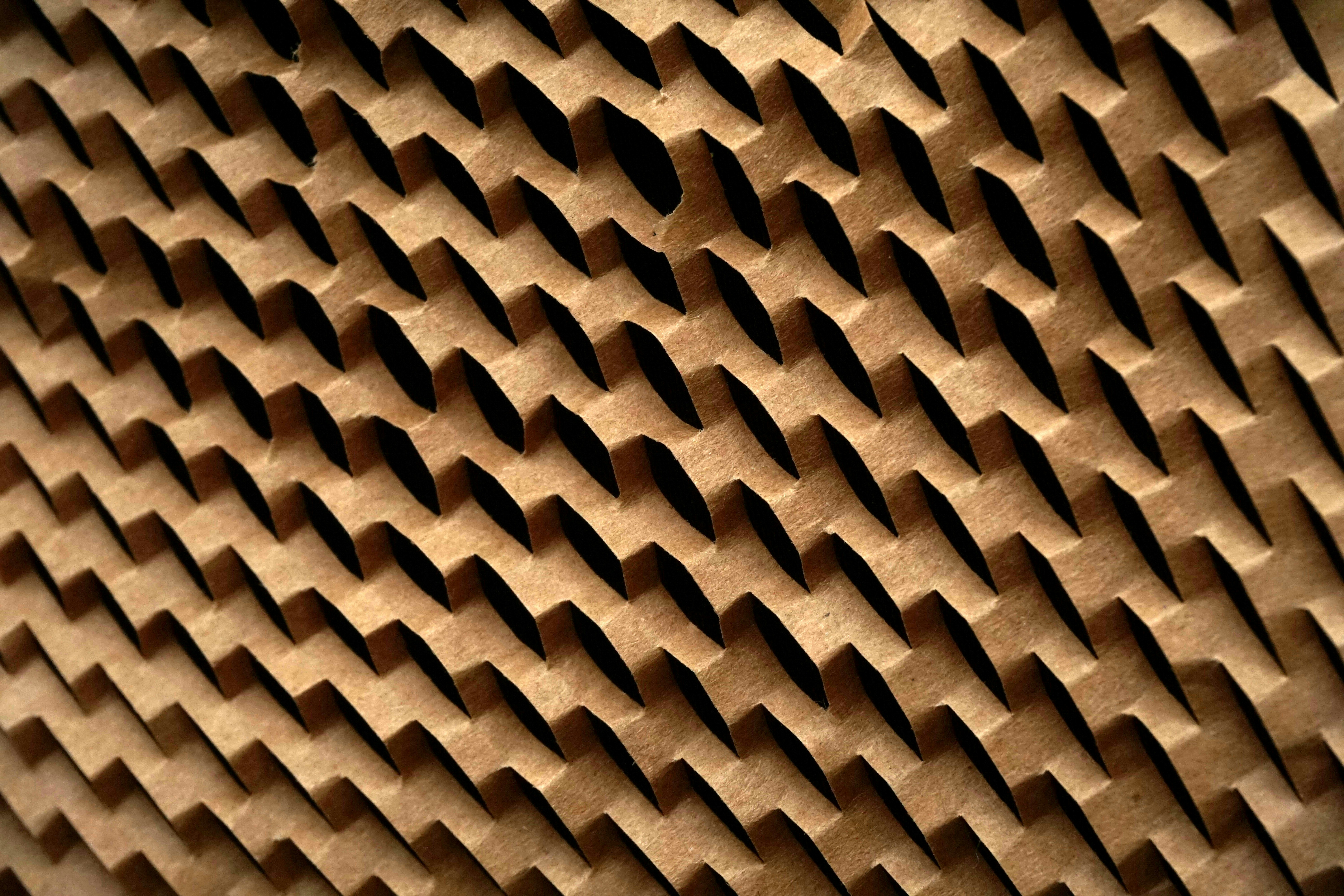 A clean stack of corrugated cardboard sheets.