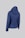 A blue, quilted jacket with a hood is displayed against a plain background. The jacket features a chevron stitch pattern and is shown from the back.