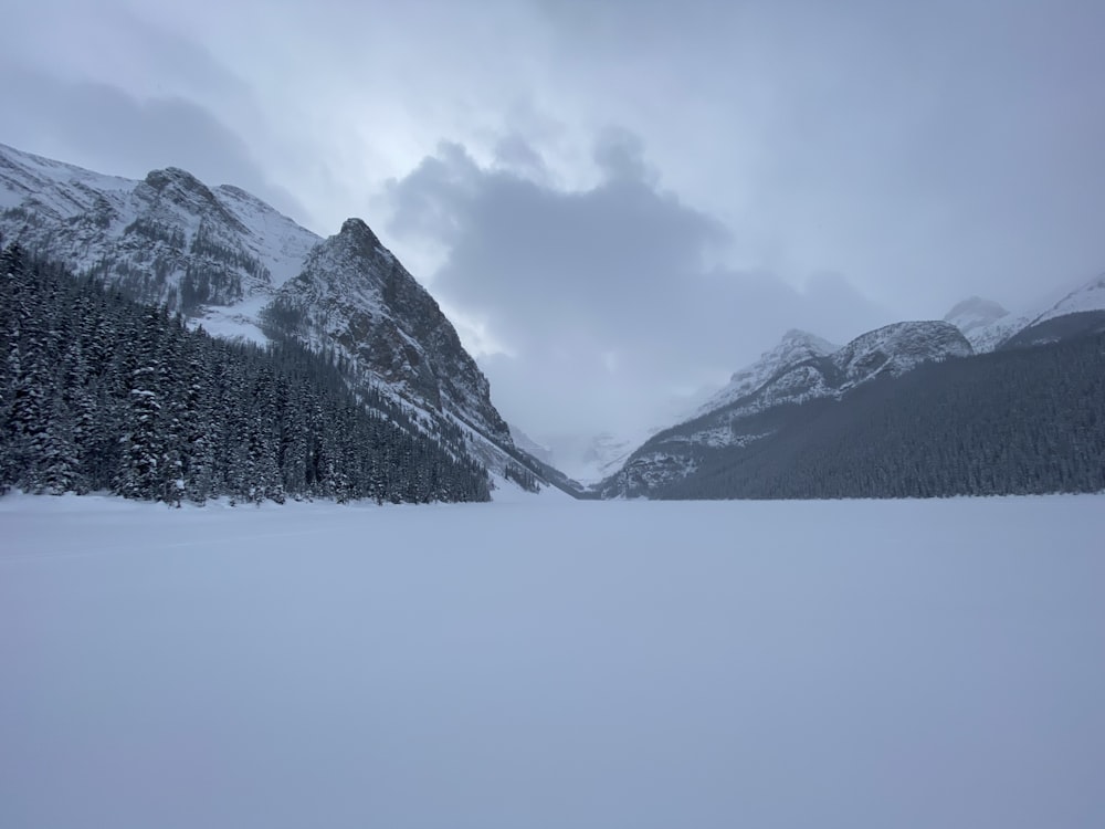 snow covered mountain under cloudy sky during daytime