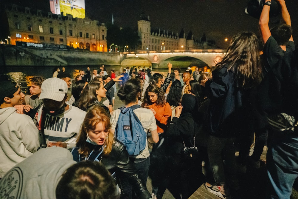 people standing on street during night time