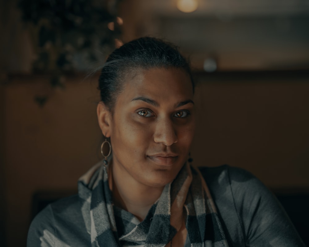 woman in gray jacket wearing eyeglasses