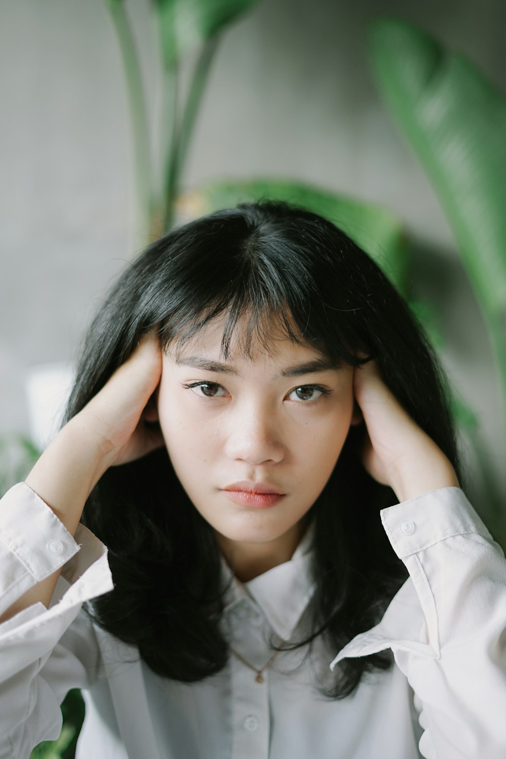 woman in white collared shirt