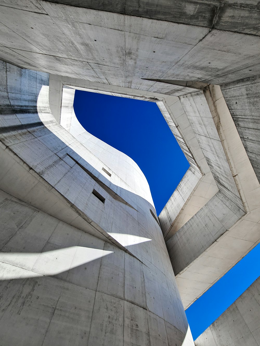 white concrete building under blue sky during daytime