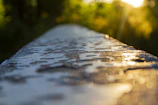 Detail of the electrostatic paint texture on a galvanized metal shelter under natural light.