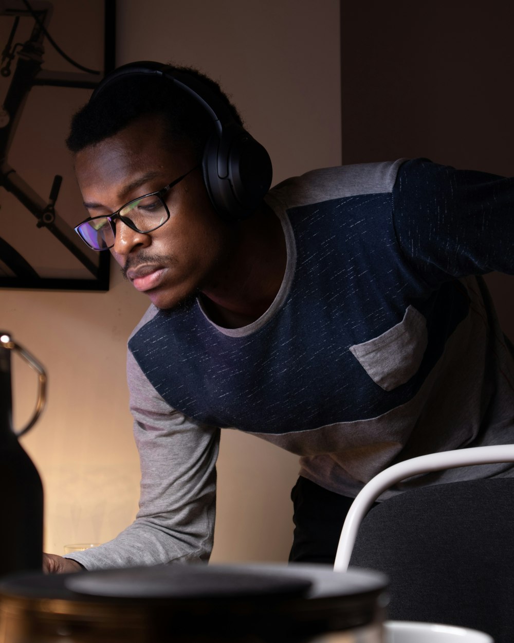 man in gray long sleeve shirt wearing black framed eyeglasses