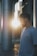 man in white crew neck t-shirt standing near glass window