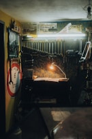 An organized workspace with tools and car parts on a bench.