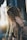 woman in black long sleeve shirt covering her face with her hair