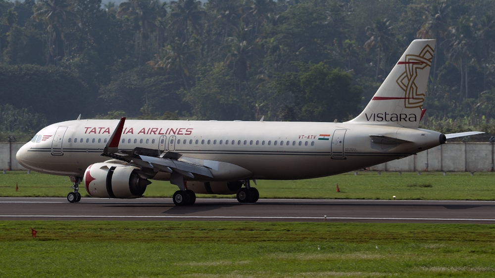 white and red air plane on airport during daytime