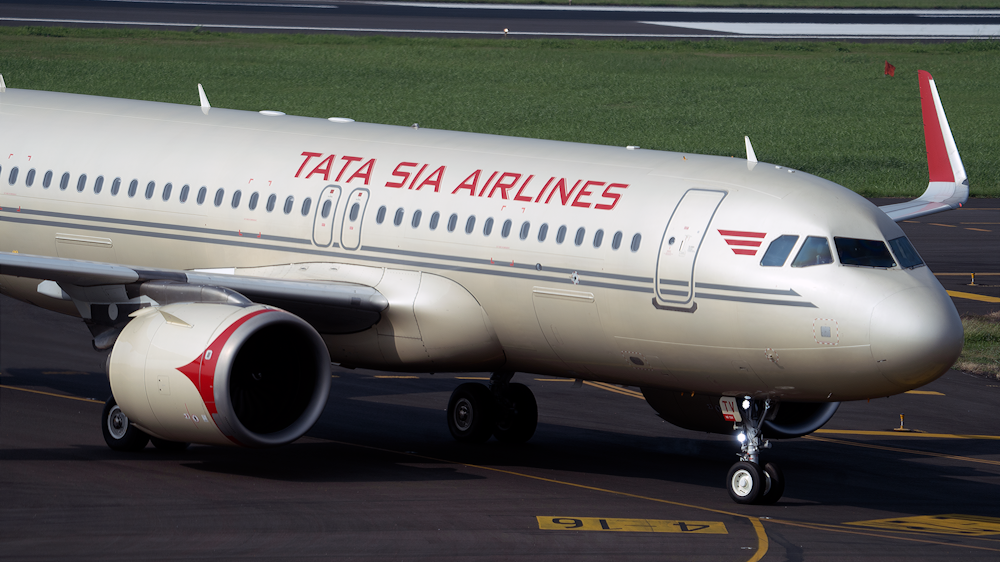 white and red air plane on airport during daytime