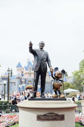 man in black suit statue