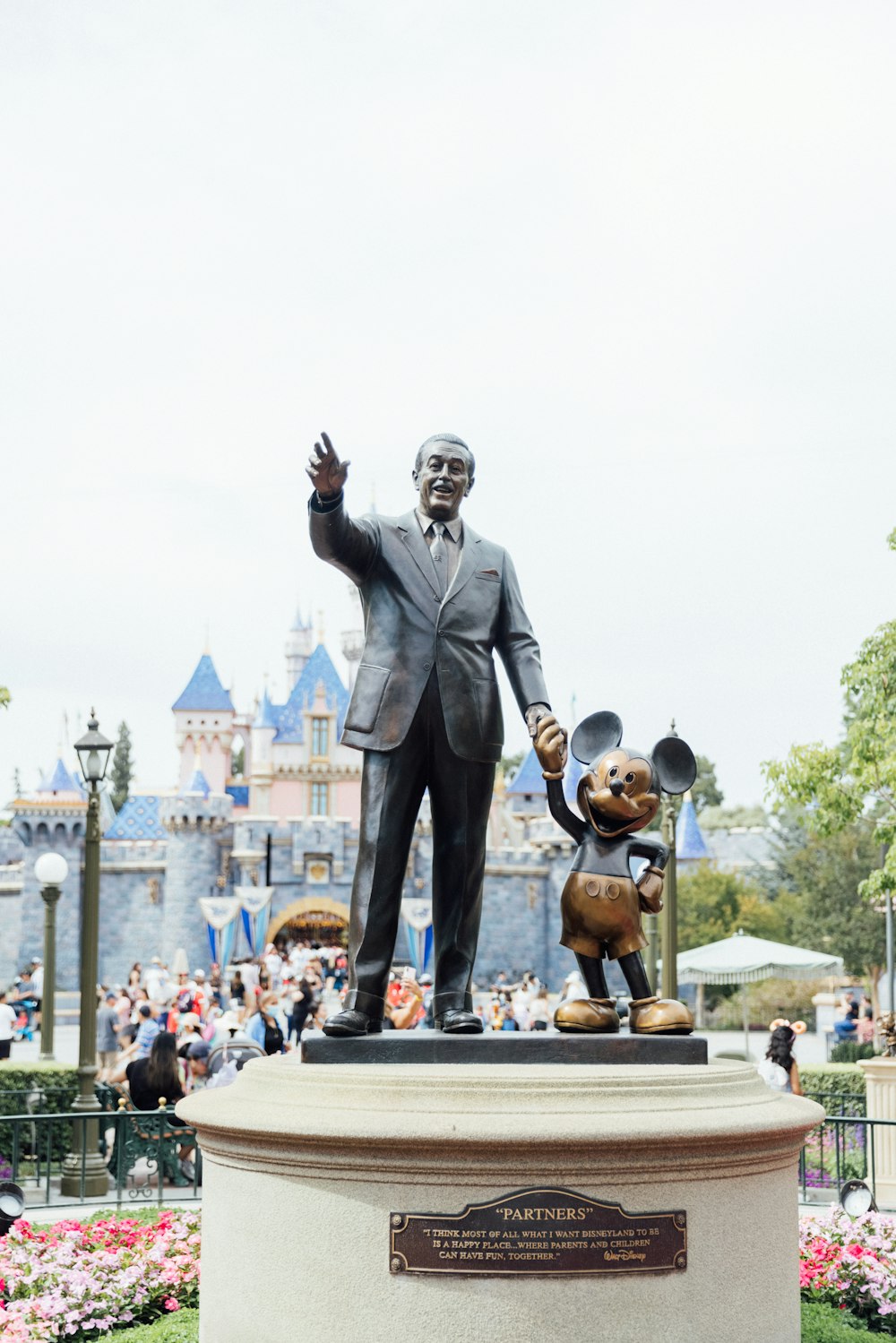 man in black suit statue