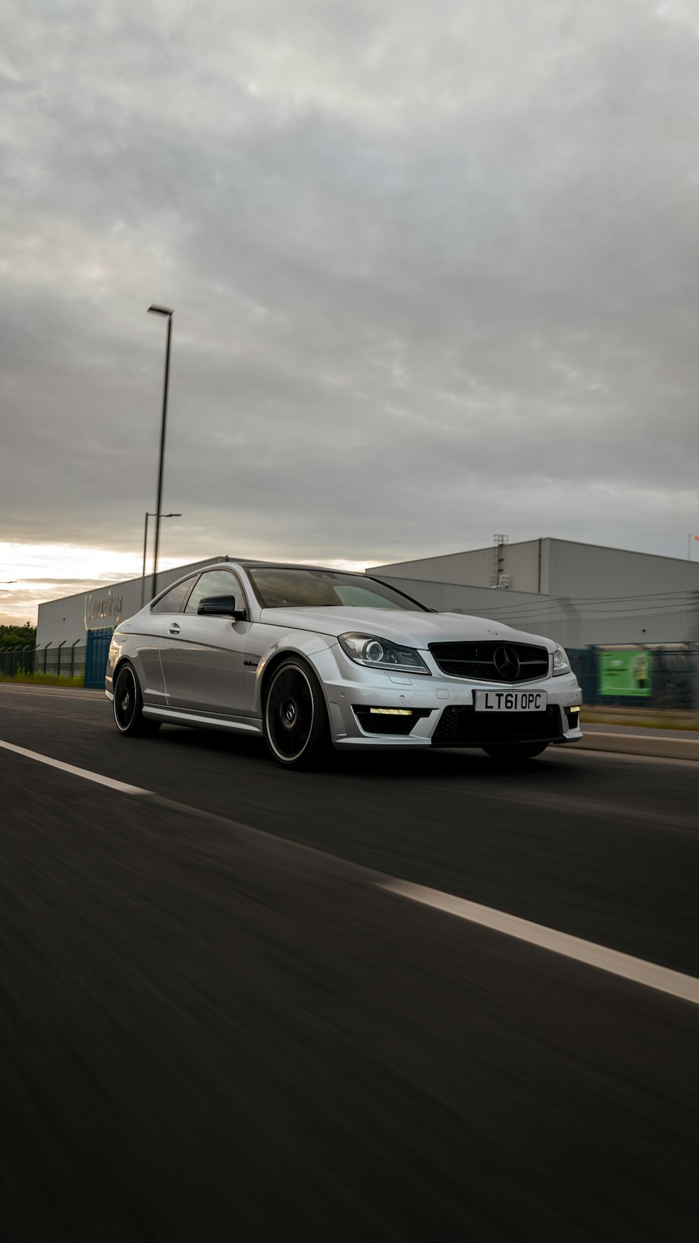 white bmw m 3 on road during daytime