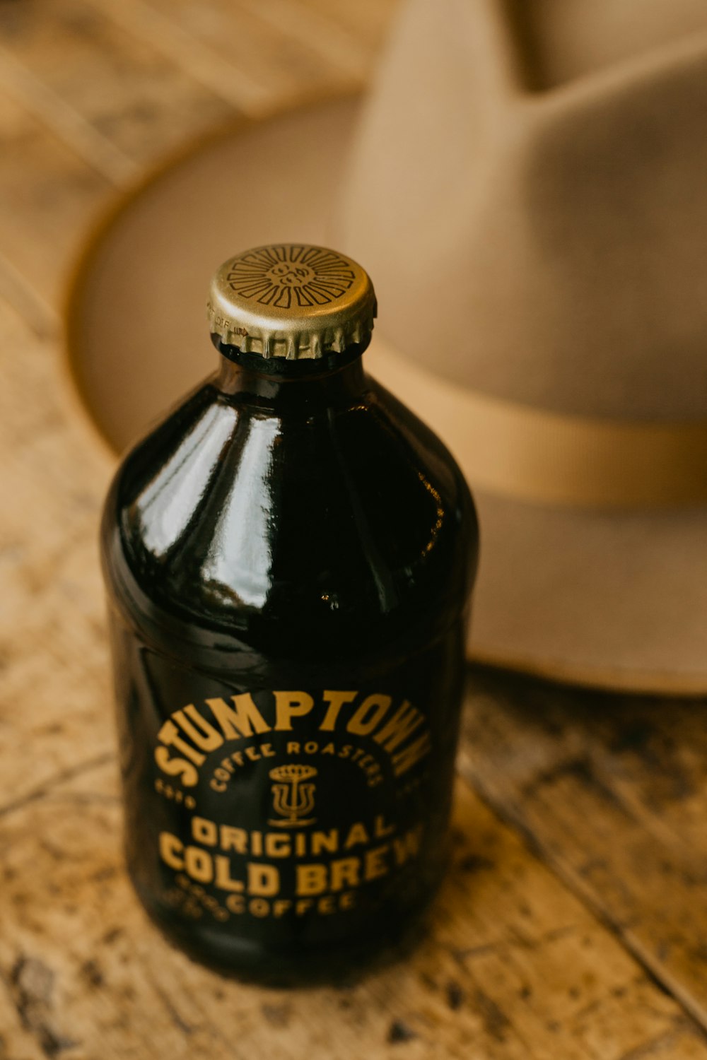 black and white bottle on brown marble table