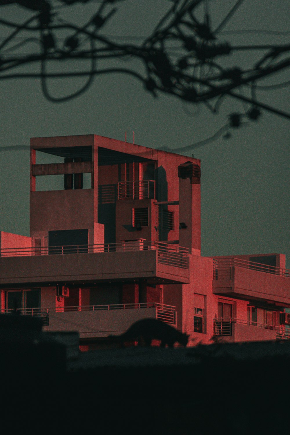 red concrete building during night time