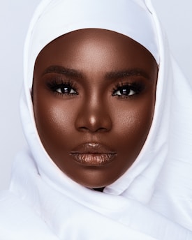 woman in white hijab taking selfie