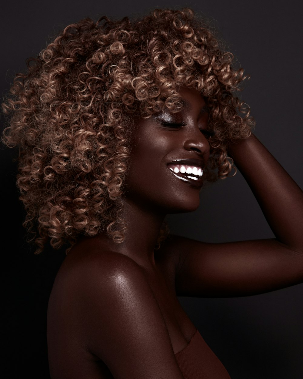 smiling woman with curly hair