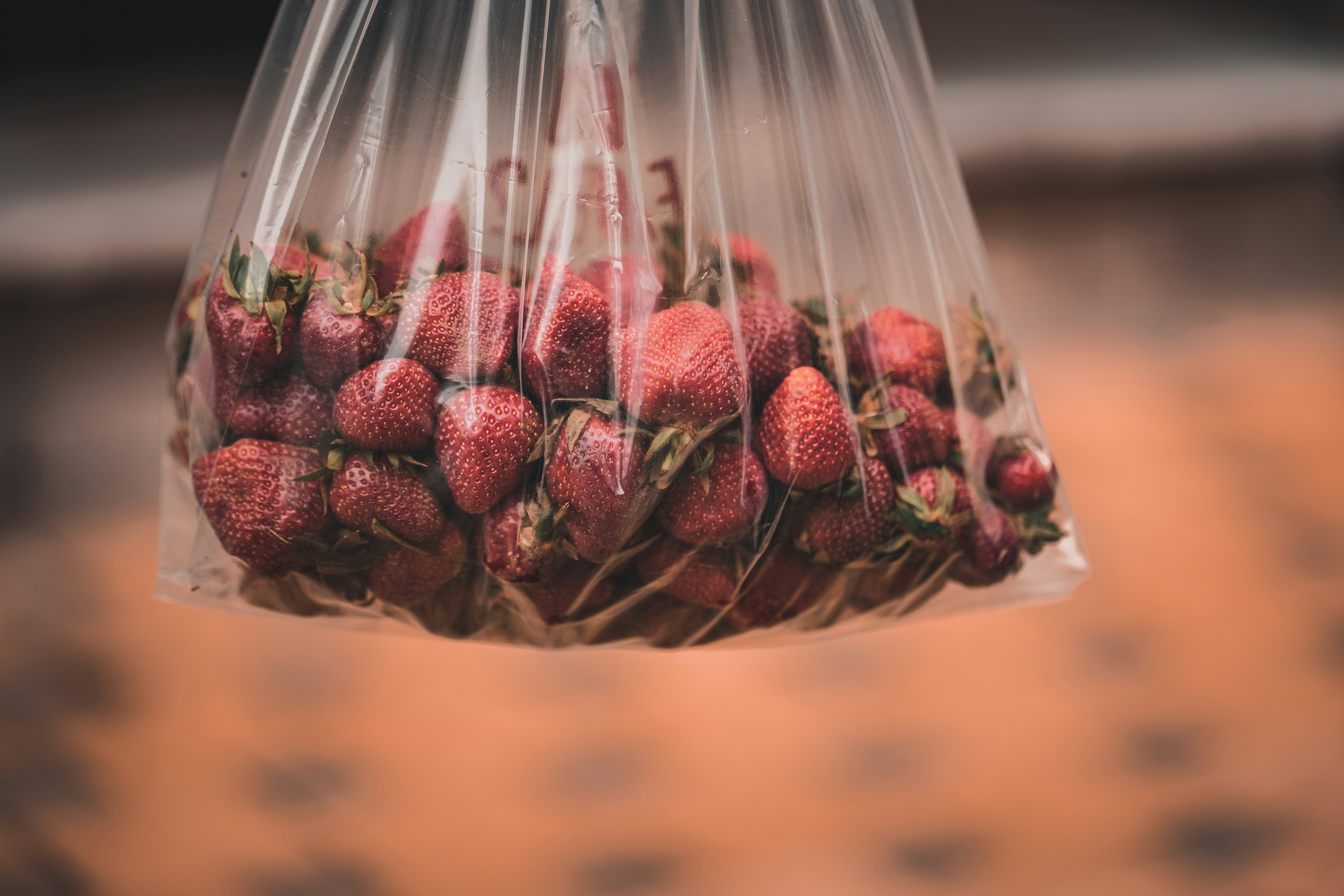 red and brown fruit in clear plastic pack