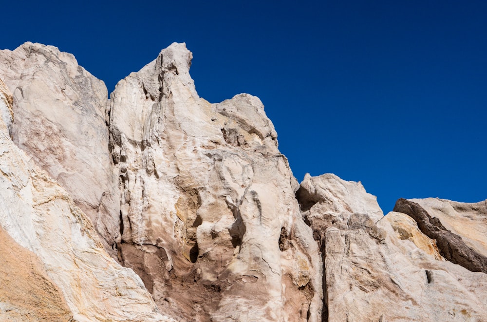 brown rocky mountain under blue sky during daytime