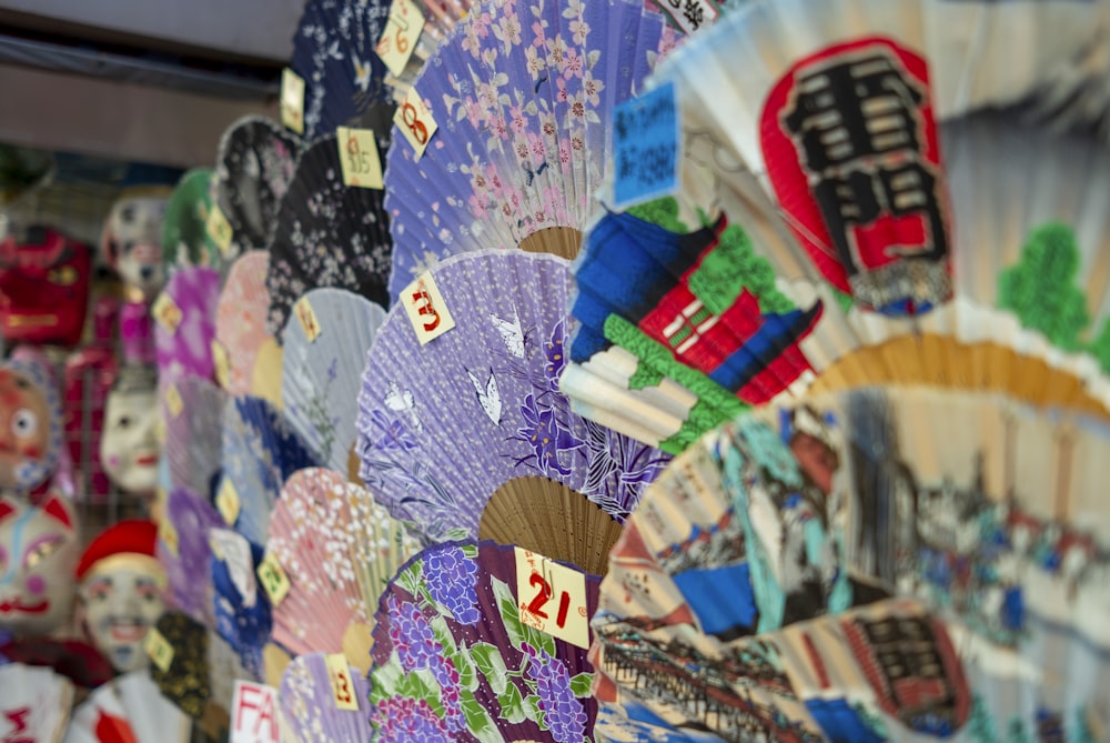 white blue and yellow hand fan